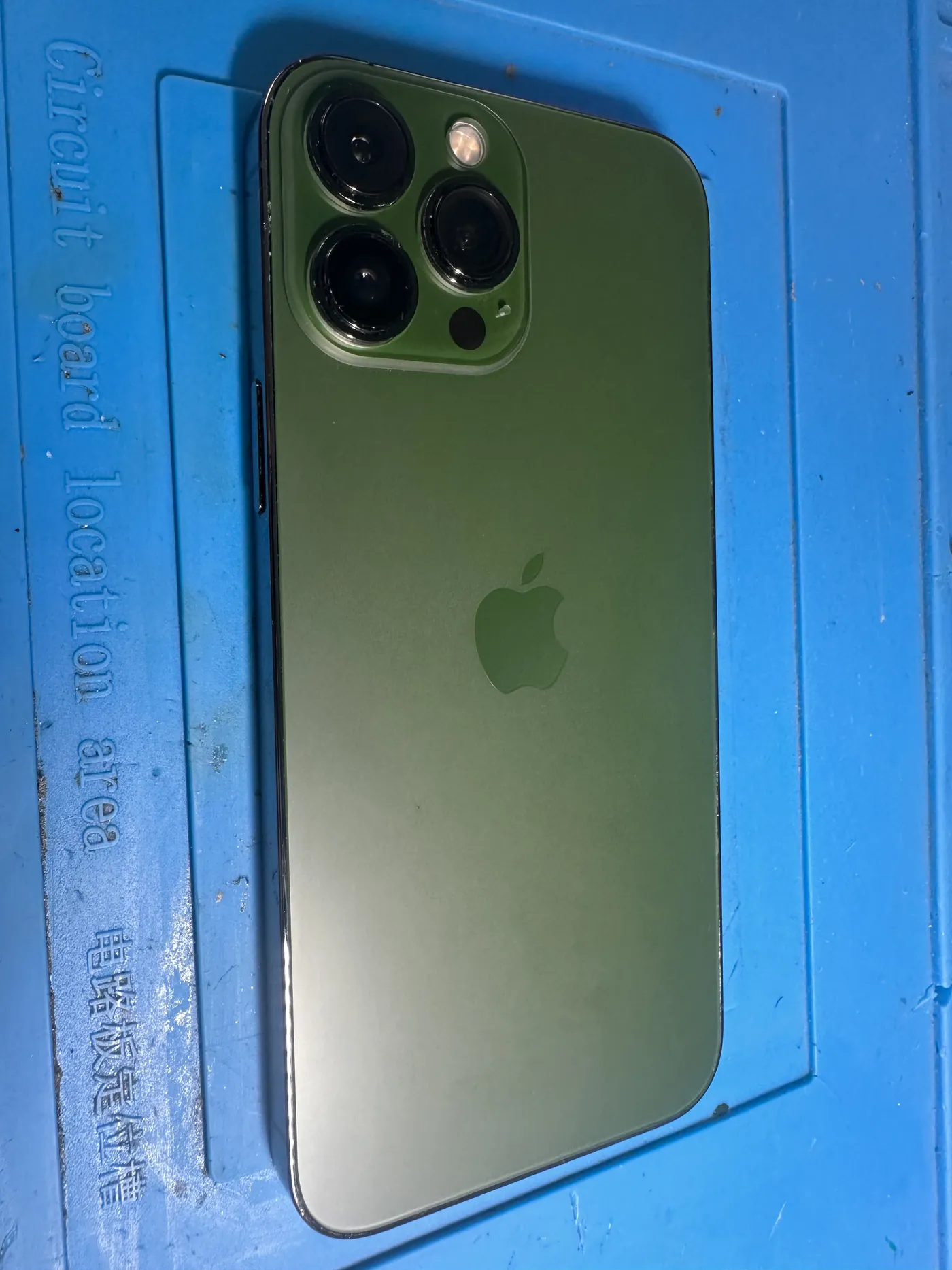 Close-up of an iPhone camera module before repair