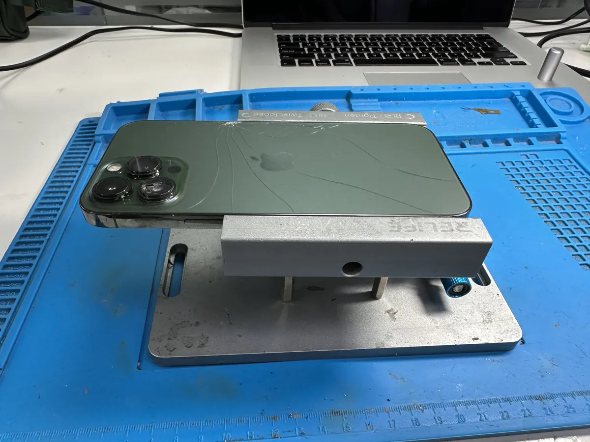 iPhone positioned on the repair mat before screen work