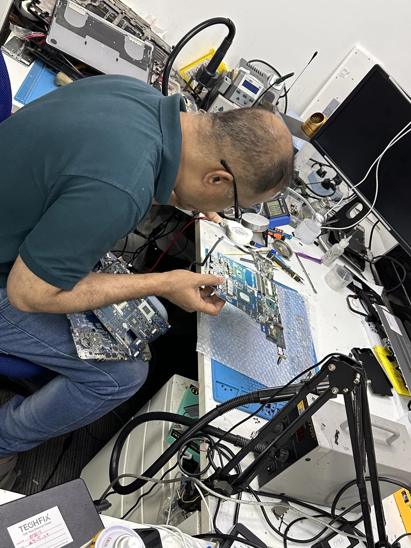 Chip-level board repair under a microscope at the TechFix workshop