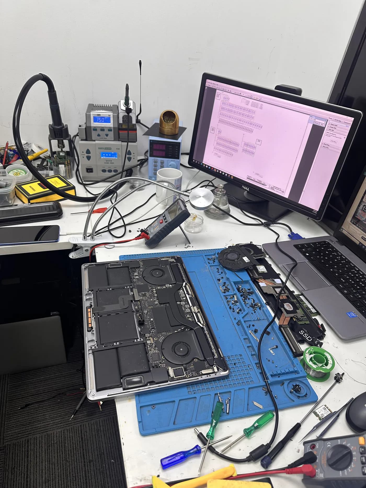 Soldering station and diagnostic tools at the TechFix workshop